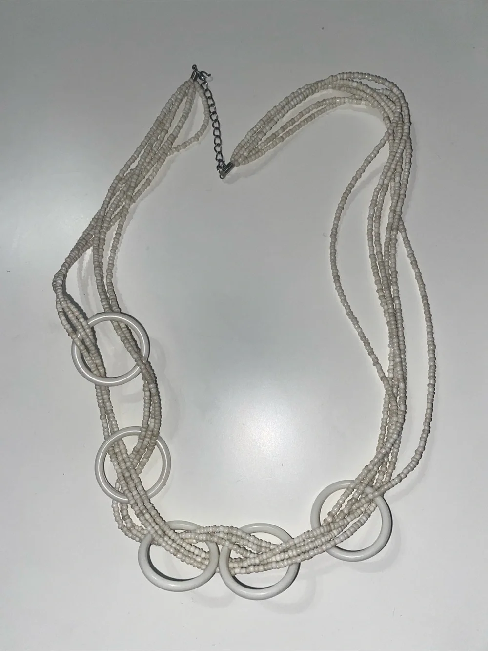 White Multi-Strand Beaded Necklace with Ring Accents